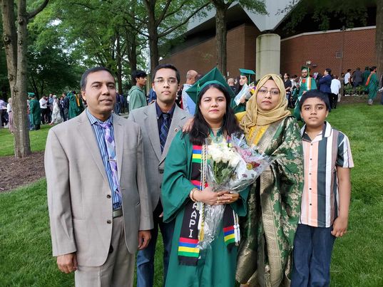 Rosy Sultana and her family celebrate her graduation from GMU.